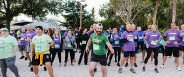 Groups of runners warm up.